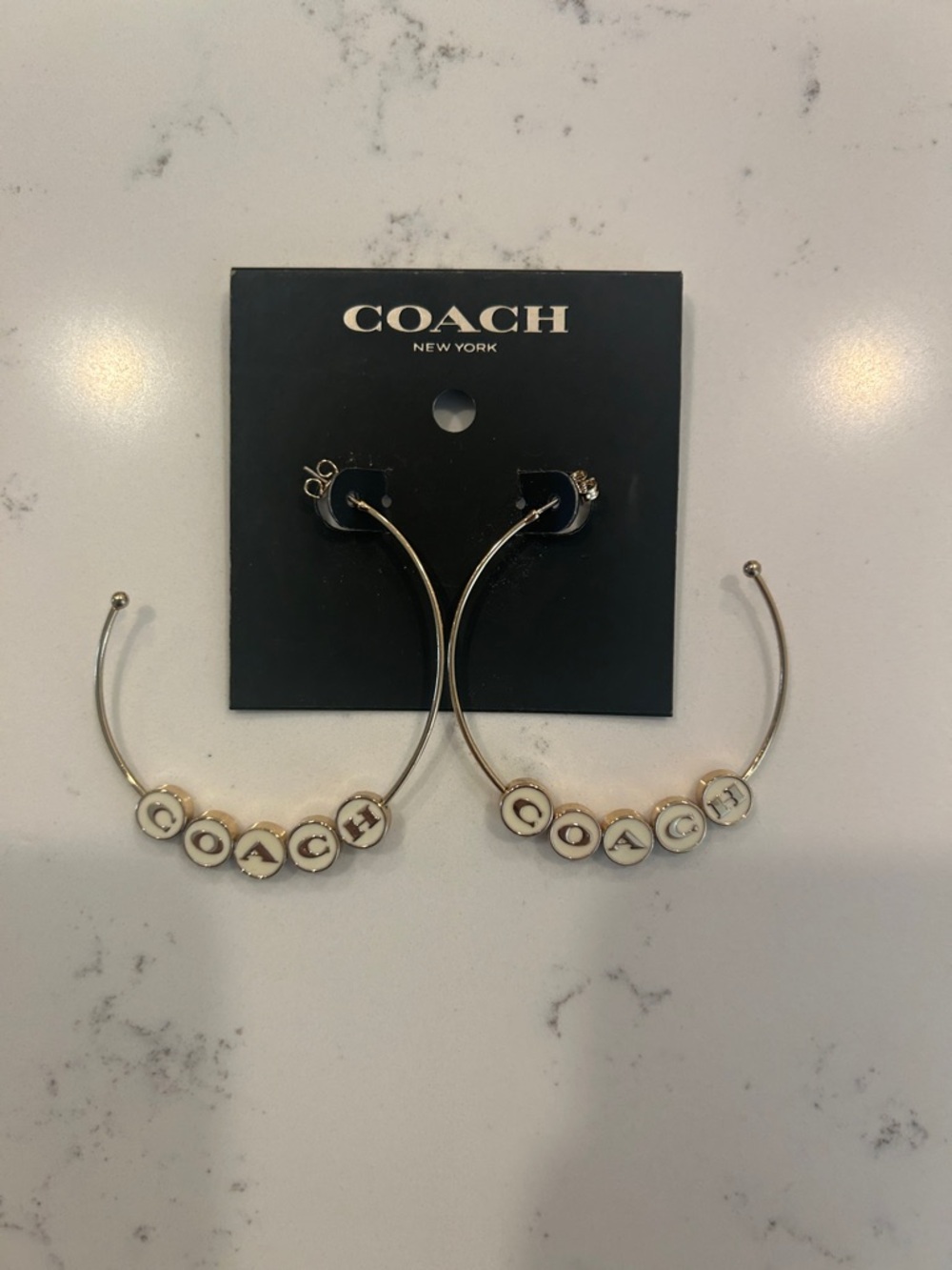 COACH Gold Hoop Earrings with White Letter Beads